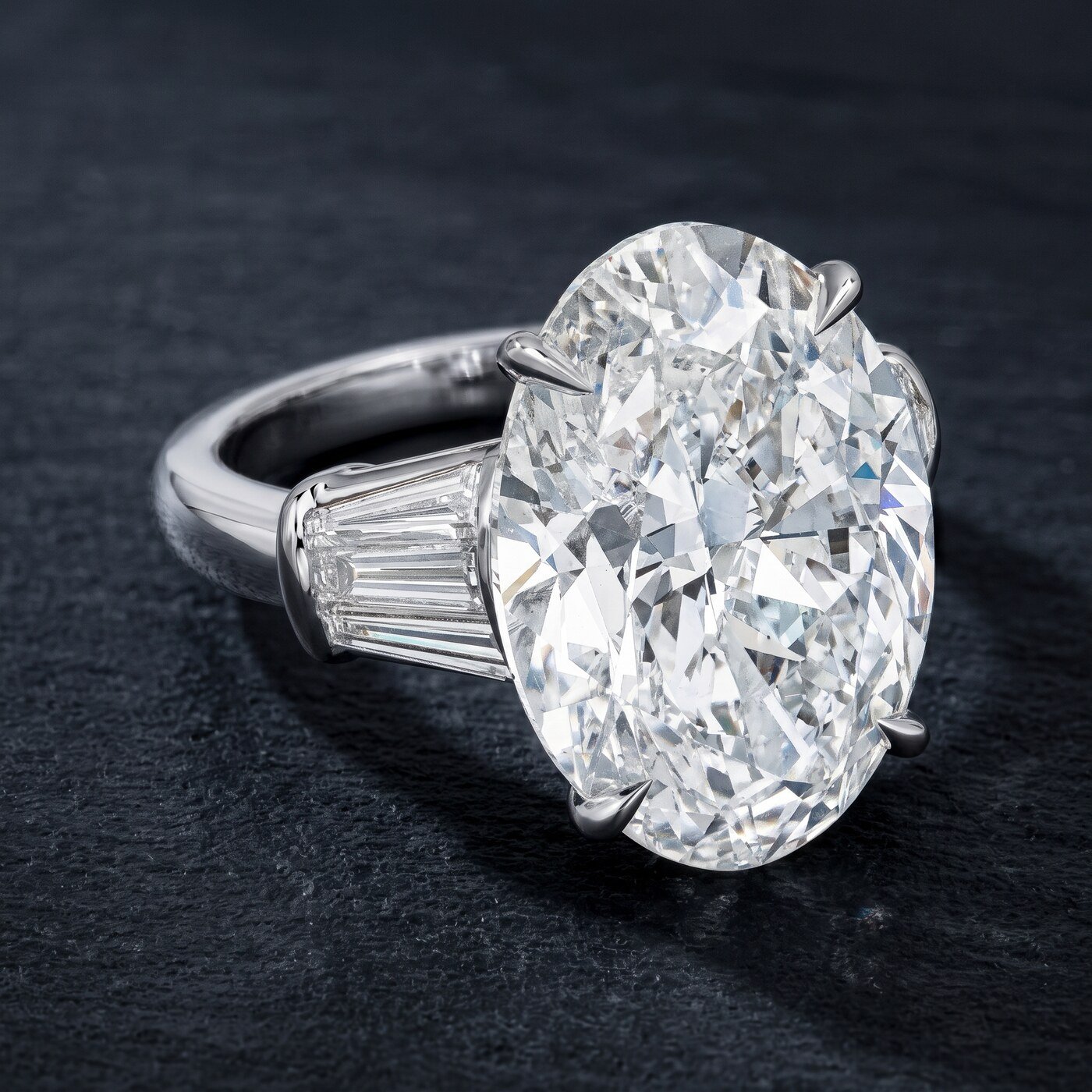 Oval three-stone diamond ring